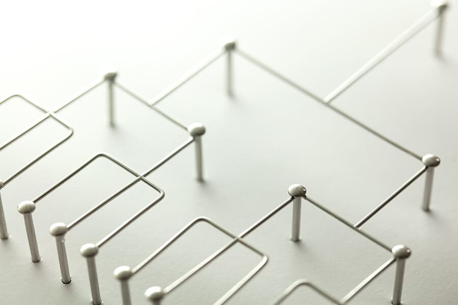 Connected metal pins showing Hierarchy in website text formatting